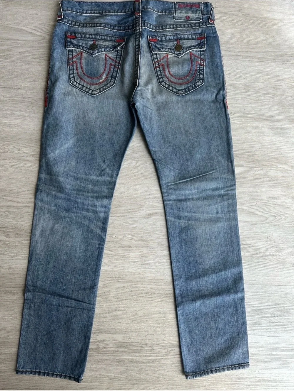 True Religion Faded Blue Slim Straight Jeans with Subtle Whiskering